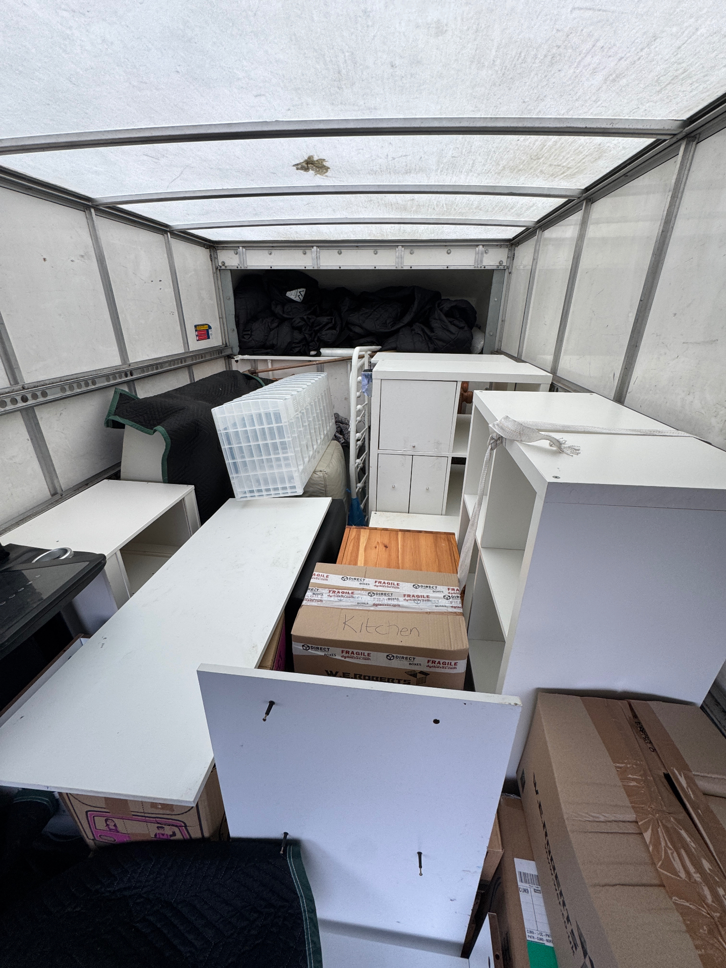 Flat-pack furniture and boxes loaded for transport